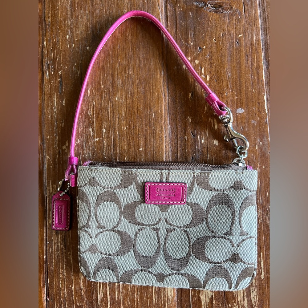 Coach wrist wallet in signature color.